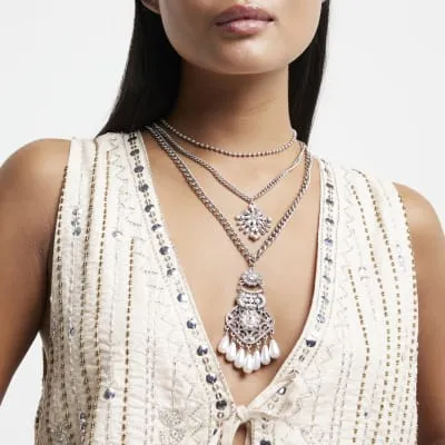 Silver pearl pendant multirow necklace sold by River Island