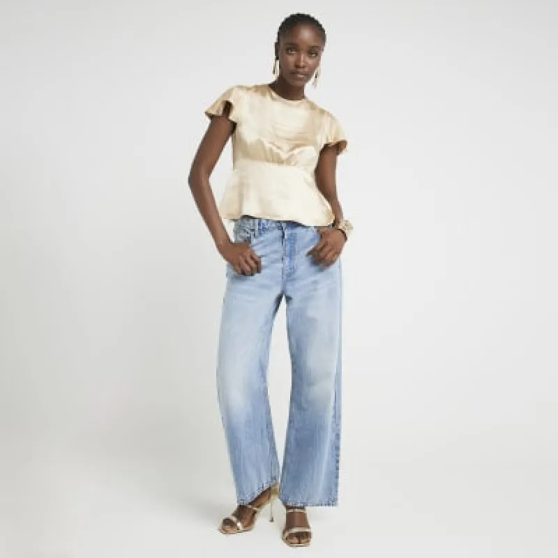 Gold Satin Peplum Blouse sold by River Island