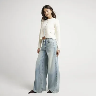Blue mid rise baggy wide jeans sold by River Island