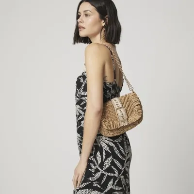 Beige raffia shoulder bag sold by River Island