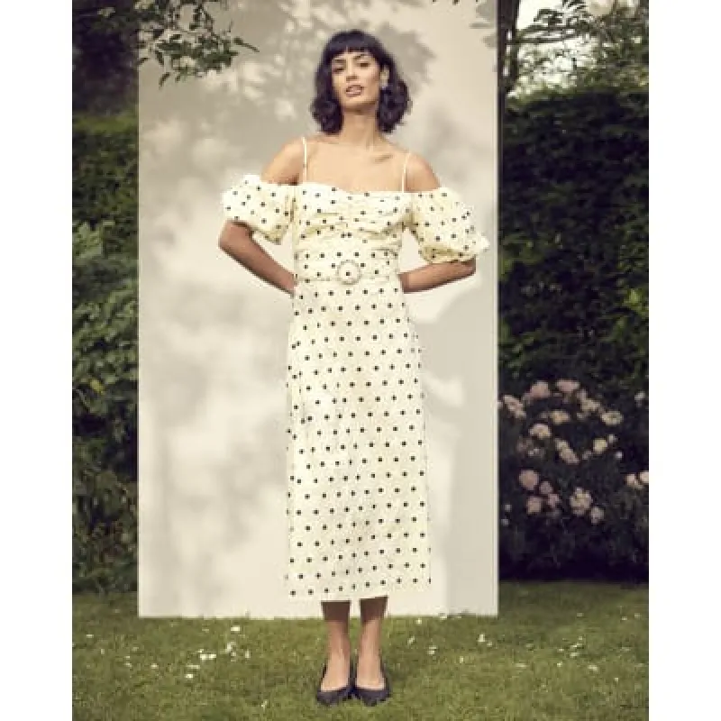 Yellow spot puff sleeve bodycon midi dress sold by River Island