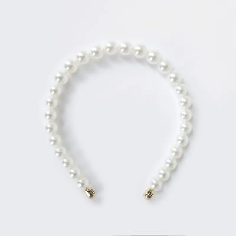 White pearl headband sold by River Island