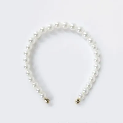 White pearl headband sold by River Island