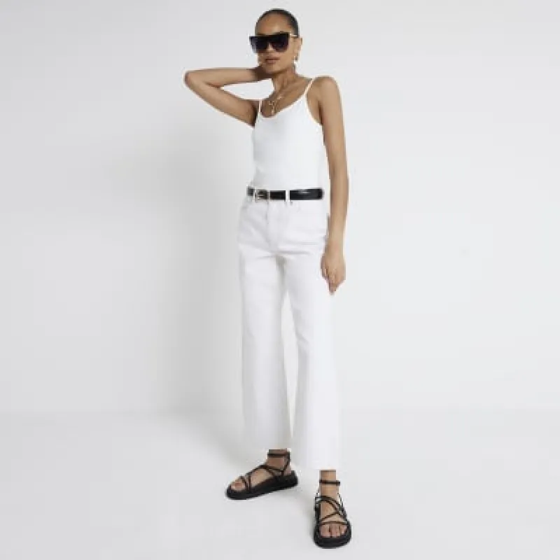 Cream cami top sold by River Island