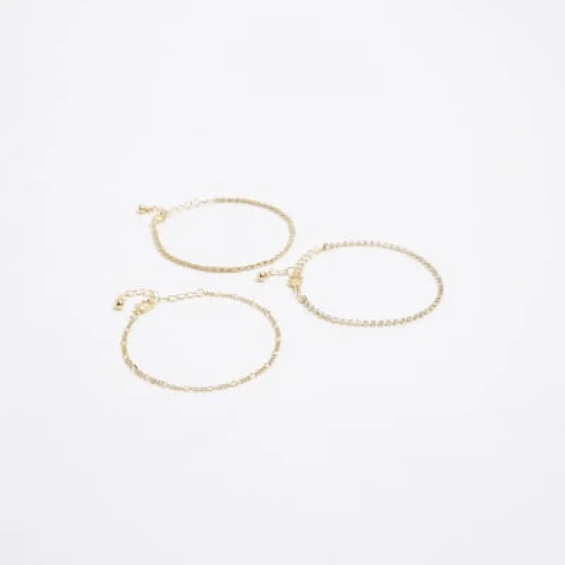 Gold plated chain bracelet multipack sold by River Island