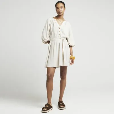 Beige linen blend belted smock mini dress sold by River Island