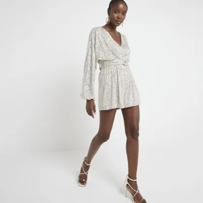 Silver sequin front knot playsuit sold by River Island