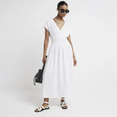 White linen blend shirred skater midi dress sold by River Island