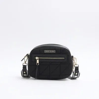 Black quilted camera cross body bag sold by River Island
