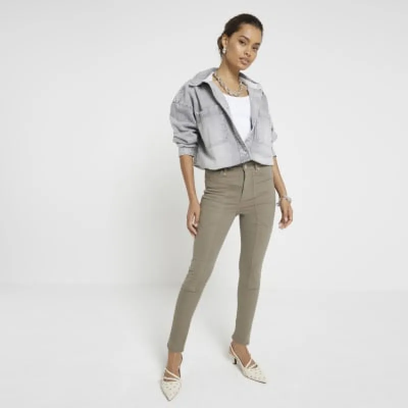 Petite khaki high waisted skinny jeans sold by River Island