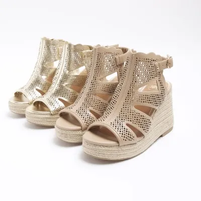 Pink cut out wedge sandals sold by River Island