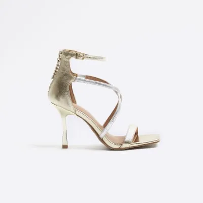 Gold closed back strappy heeled sandals sold by River Island