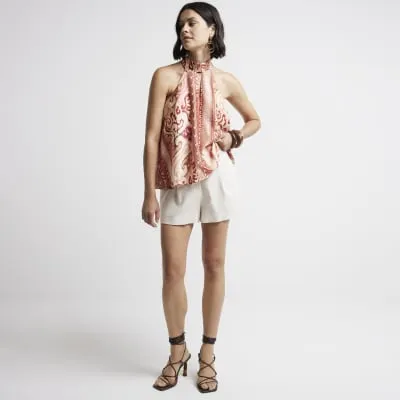 Rust satin abstract halter neck top sold by River Island