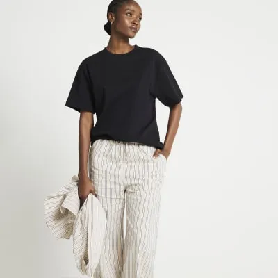 Black oversized plain t-shirt sold by River Island