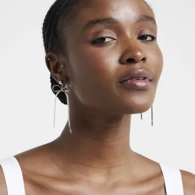 Silver Sleek Bow Stud Earrings sold by River Island