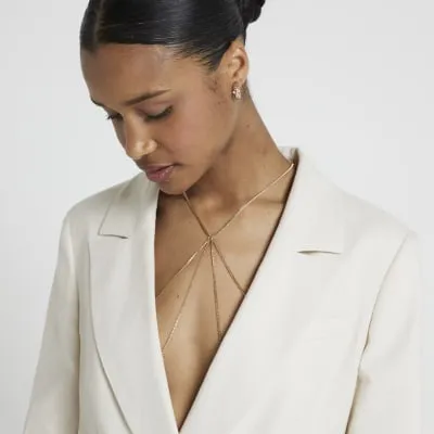 Gold colour bodychain sold by River Island