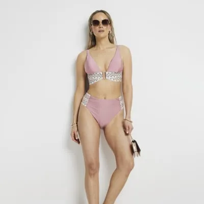 Pink elastic strap bikini bottoms sold by River Island