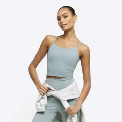 Green crop vest top sold by River Island
