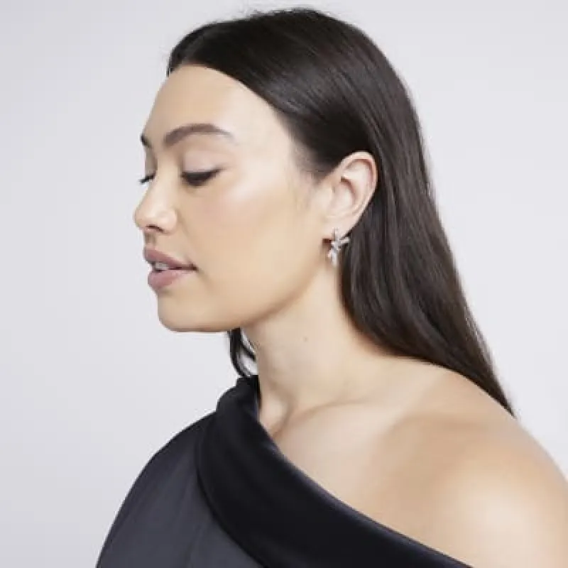 Silver Diamante Bow Stud Earrings sold by River Island