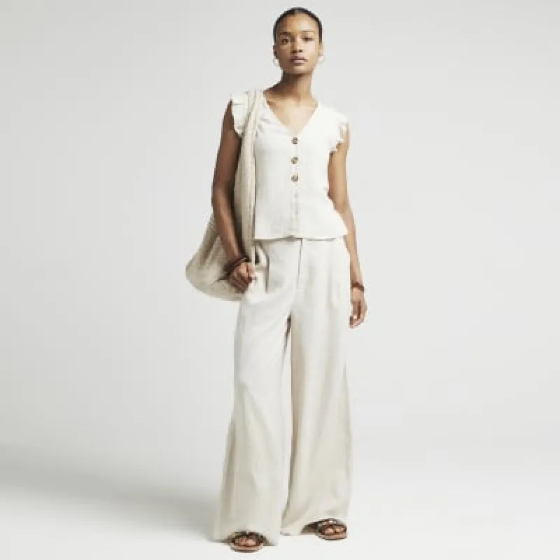 Beige linen blend wide leg trousers sold by River Island