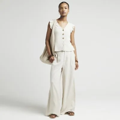 Beige linen blend wide leg trousers sold by River Island