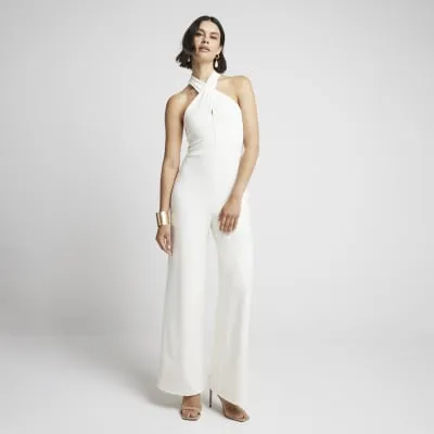Cream Crossed Halter Neck Jumpsuit sold by River Island