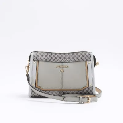 Grey RI monogram panel cross body bag sold by River Island