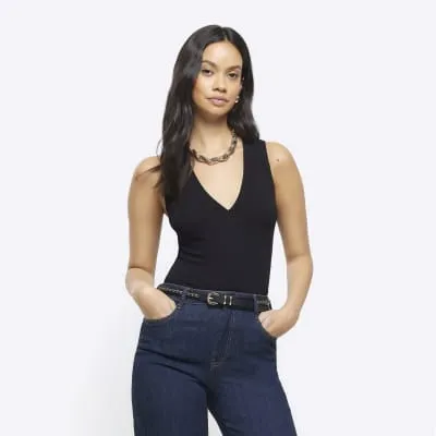 Black ribbed v neck vest top sold by River Island