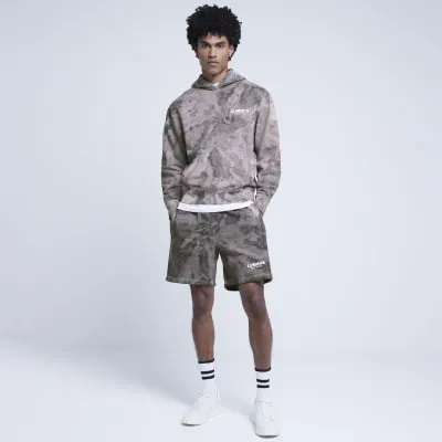 Purple regular fit tie dye shorts sold by River Island