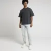 Blue tapered fit jeans sold by River Island