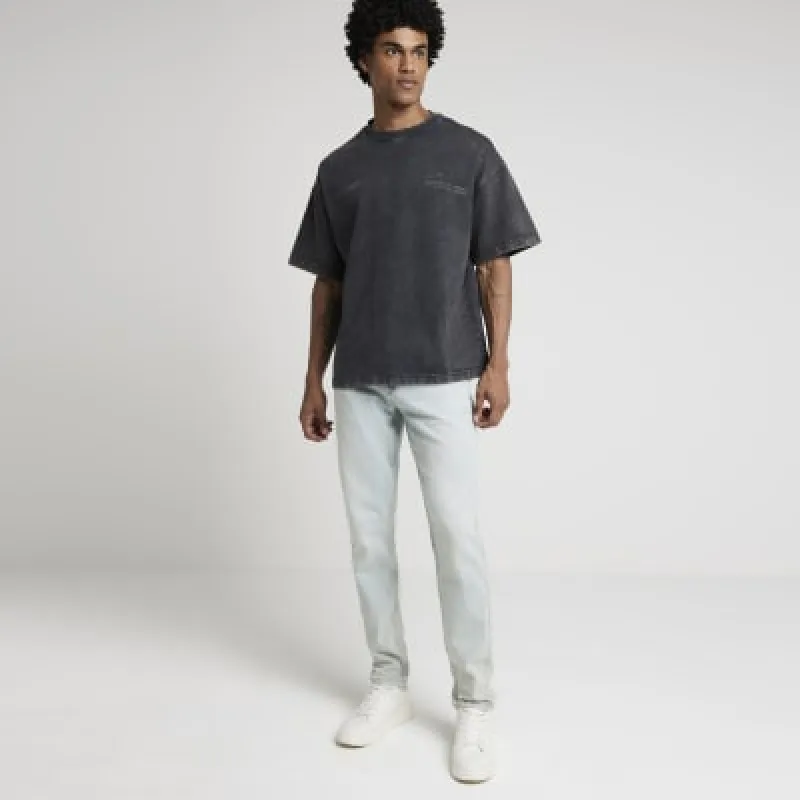 Blue tapered fit jeans sold by River Island