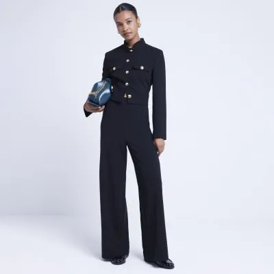 Black wide leg trousers sold by River Island