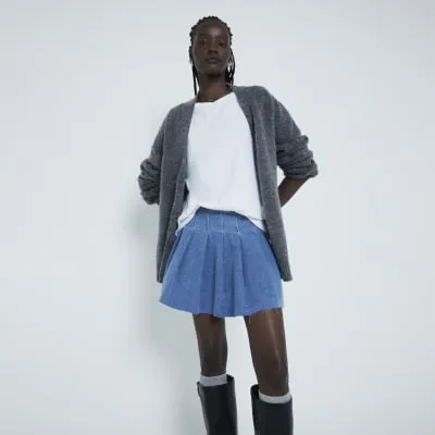 Blue denim pleated mini skirt sold by River Island