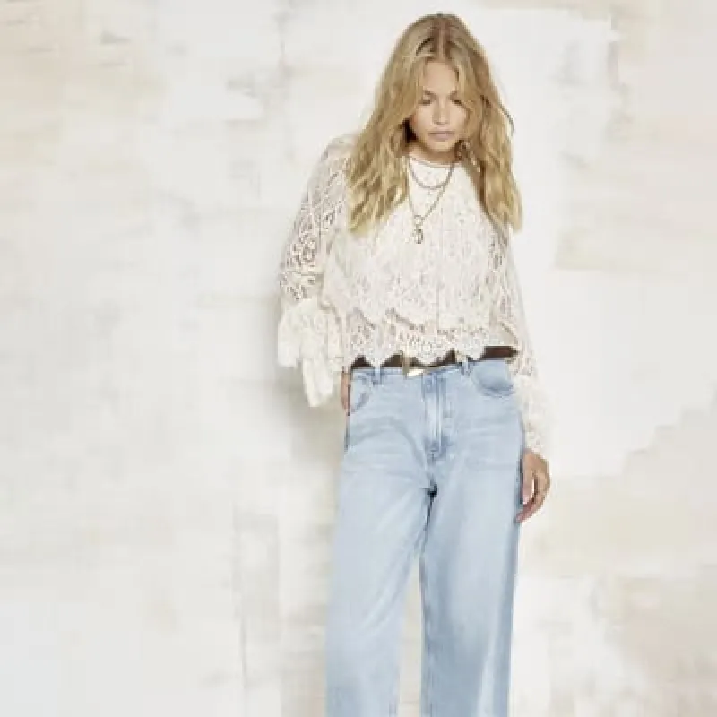 Cream lace frill long sleeve blouse sold by River Island
