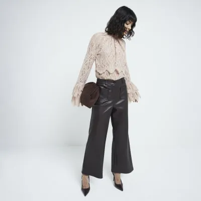 Brown faux leather pocket straight trousers sold by River Island