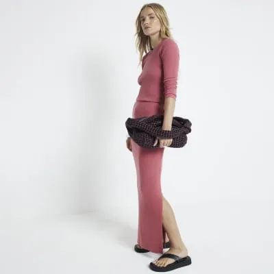 Pink ribbed maxi skirt sold by River Island