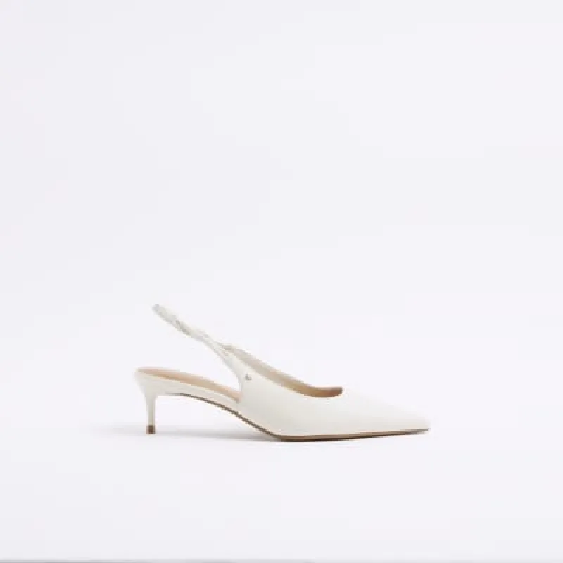 Cream heeled sling back court shoes sold by River Island