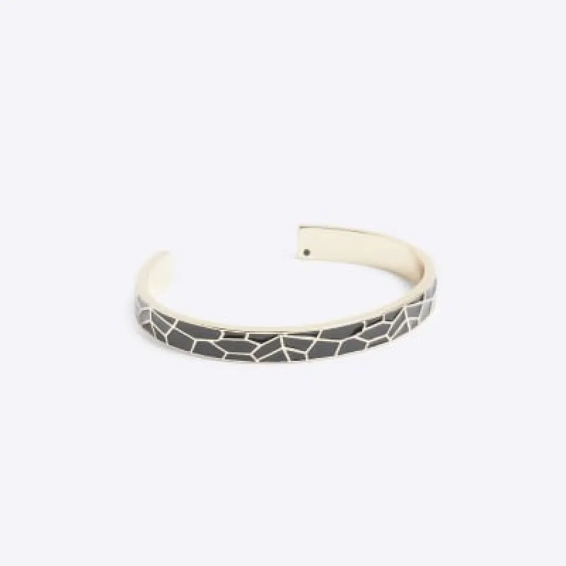 Black enamel bangle sold by River Island
