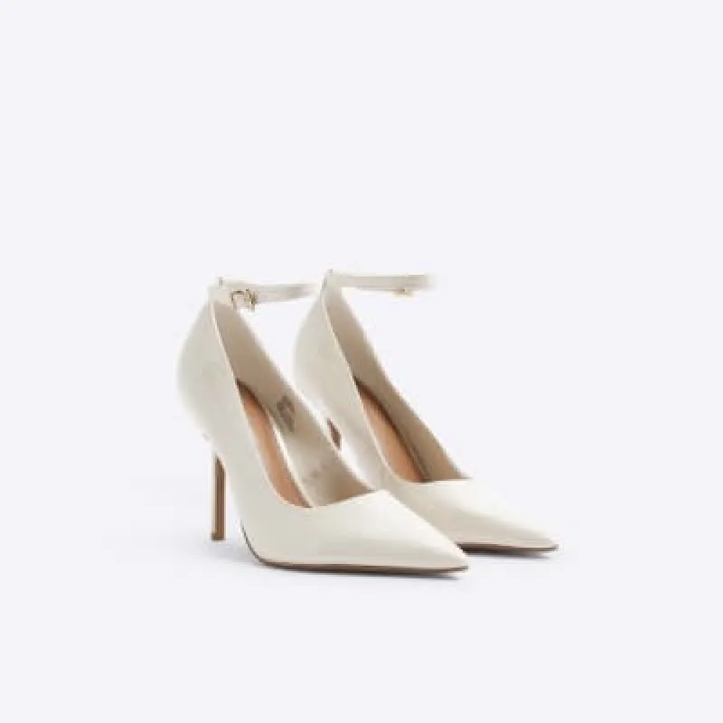 Cream ankle strap heeled court shoes sold by River Island