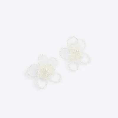 White flower pearl stud earrings sold by River Island