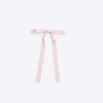 Pink skinny bow hair clip sold by River Island