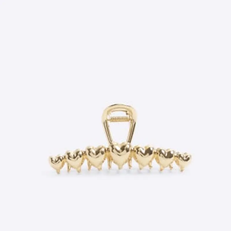 Gold heart hair clip sold by River Island