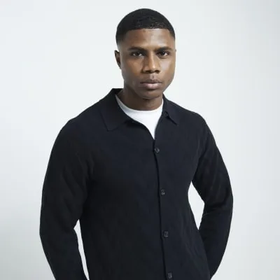 Black slim fit knit long sleeve polo shirt sold by River Island