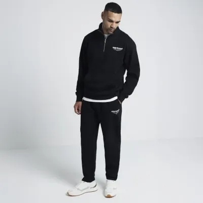 Black regular fit open hem joggers sold by River Island
