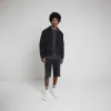 Black loose fit denim jorts sold by River Island