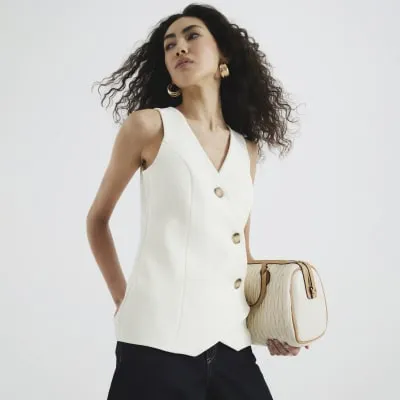 Cream Asymmetric Button Waistcoat sold by River Island