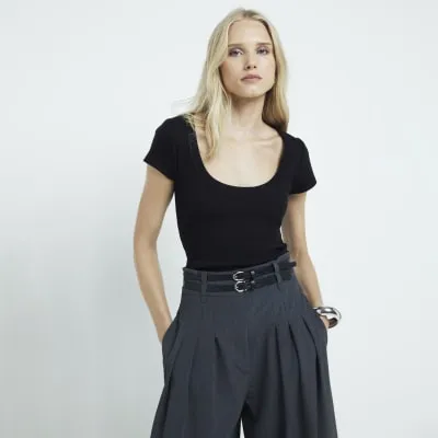 Black ribbed scoop neck vest top sold by River Island