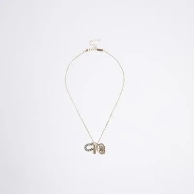 Gold Horseshoe Necklace sold by River Island