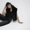 Black faux fur crop gilet sold by River Island