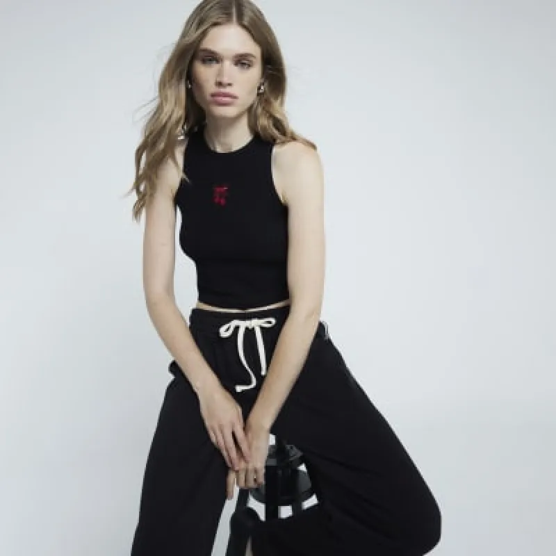 Black Cherry Embroidered Ribbed Cropped Vest sold by River Island